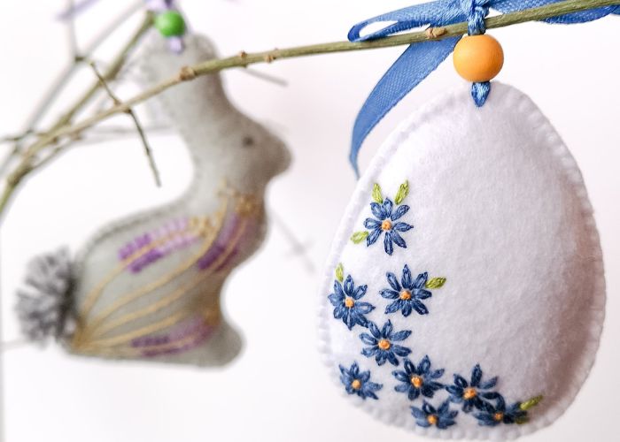 Easter egg and bunny felt decorations on a branch
