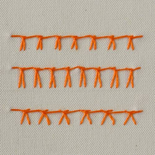 German knotted blanket stitch embroidered with orange thread - front side