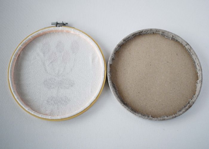 Two hoops framed with glue with different techniques back view