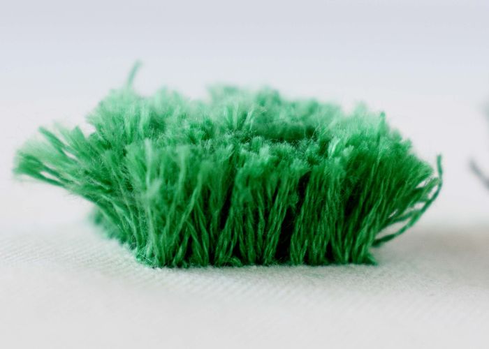 Turkey work embroidery with six strands of green embroidery floss