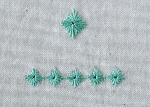 Diamond Eyelet Stitch Embroidery with green perle cotton
